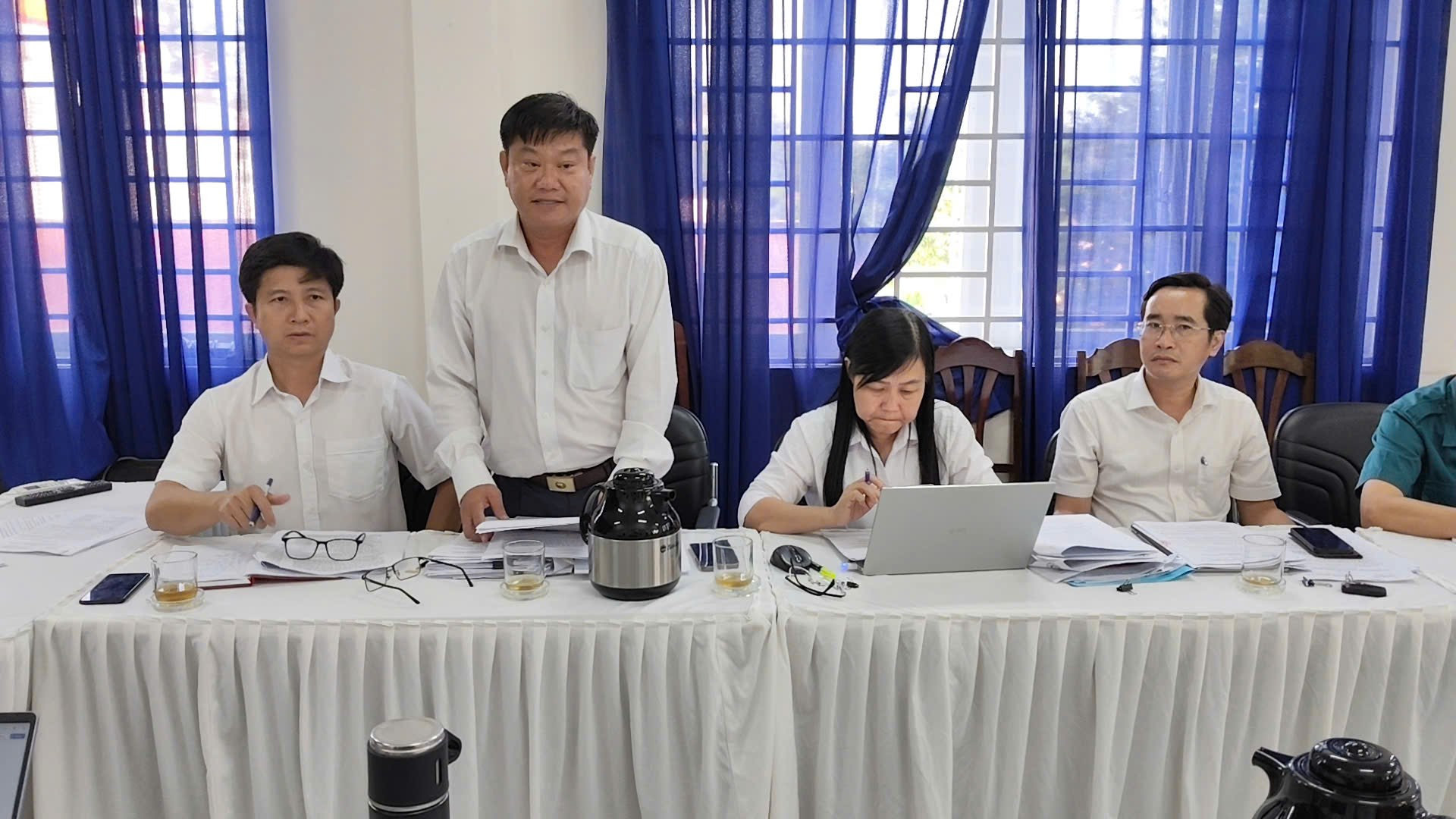 'A group of people sitting at a table

Description automatically generated'